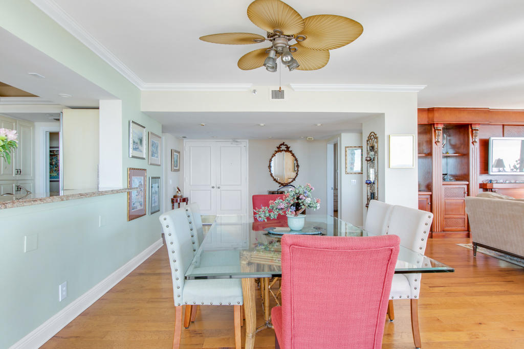 4100 North Ocean Drive, Unit 1002 Singer Island, FL 33404 - Photo 6 of 37 a view of a dining room with furniture and a chandelier