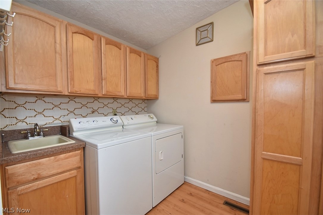 6396 Springwood Road Parma Heights, OH 44130 - Photo 11 of 22 Great laundry area with lots of storage!