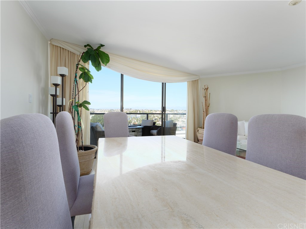 531 Esplanade, Unit 913 Redondo Beach, CA 90277 - Photo 11 of 42 a living room with furniture and a large window