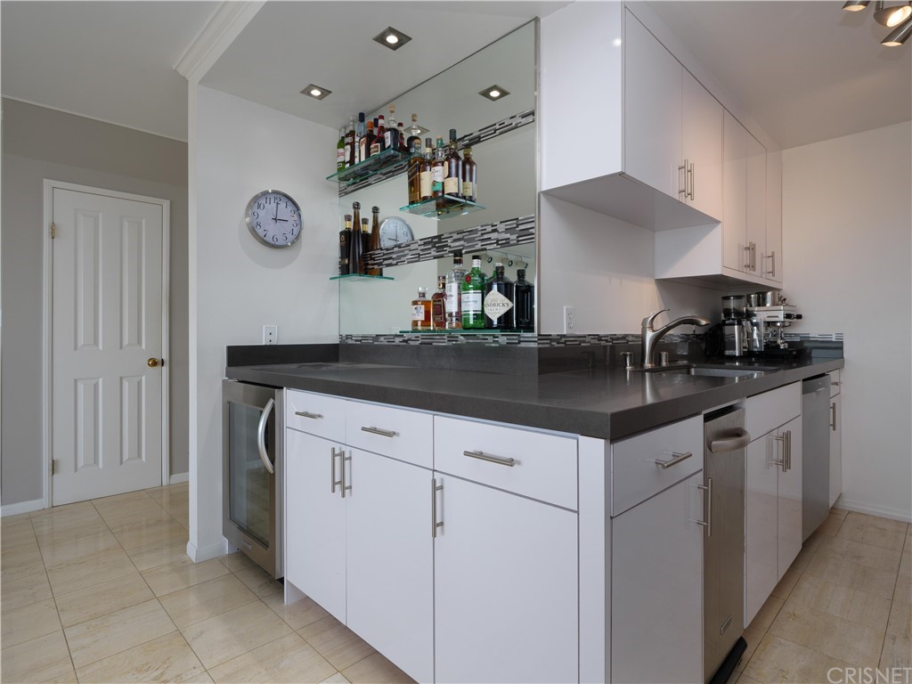 531 Esplanade, Unit 913 Redondo Beach, CA 90277 - Photo 19 of 42 a kitchen with a sink and cabinets