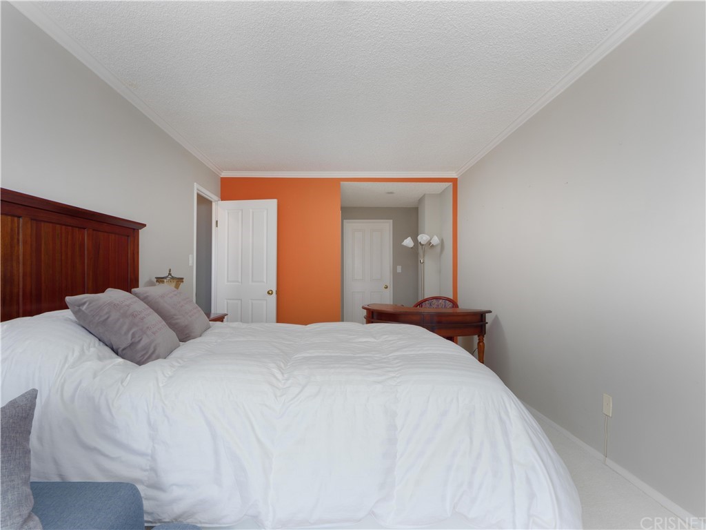 531 Esplanade, Unit 913 Redondo Beach, CA 90277 - Photo 29 of 42 a bedroom with a bed and a closet