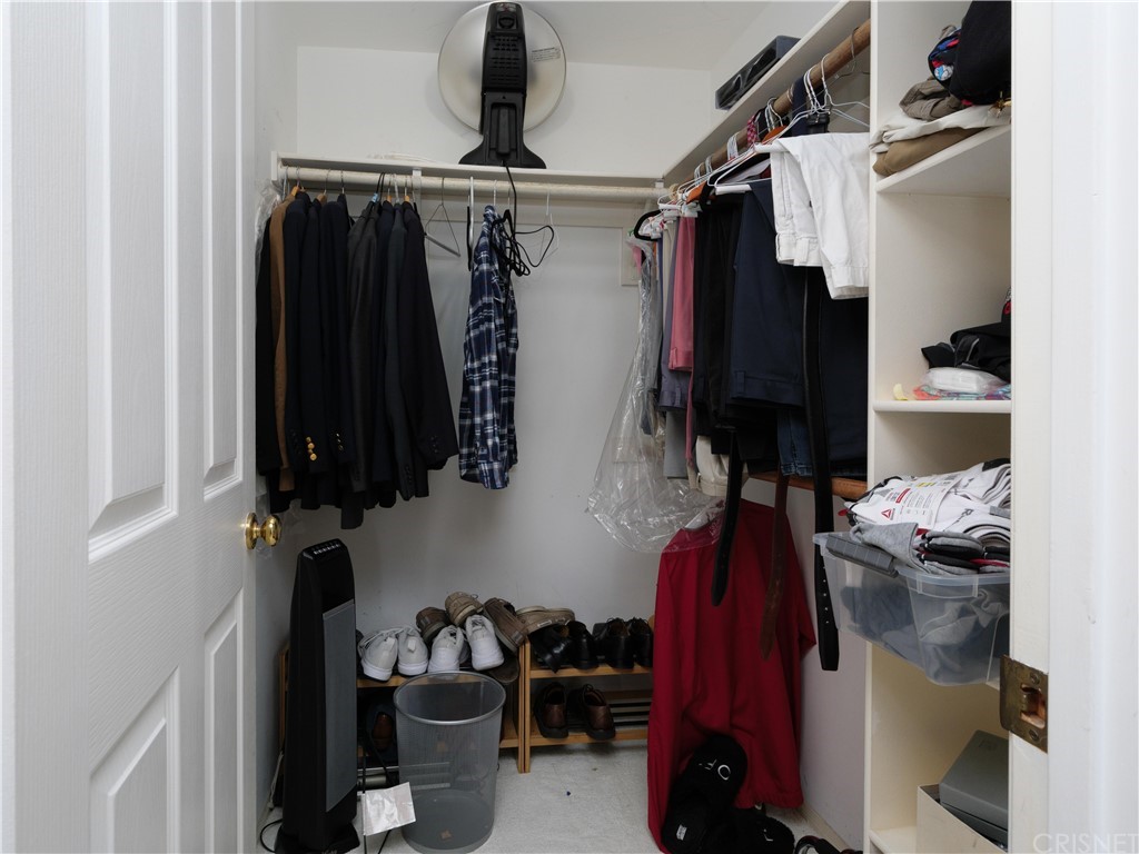 531 Esplanade, Unit 913 Redondo Beach, CA 90277 - Photo 30 of 42 a view of walk in closet with clothes and shoes