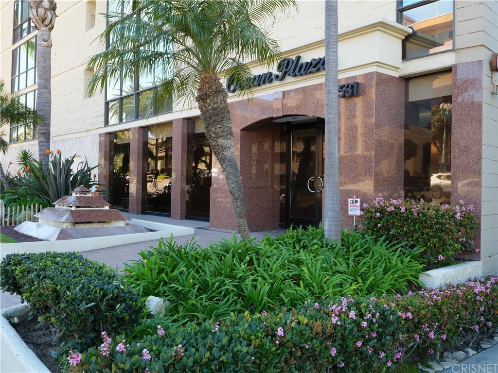531 Esplanade, Unit 913 Redondo Beach, CA 90277 - Photo 3 of 42 a front view of a house with garden