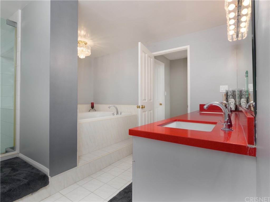 531 Esplanade, Unit 913 Redondo Beach, CA 90277 - Photo 31 of 42 a bathroom with a sink and a mirror