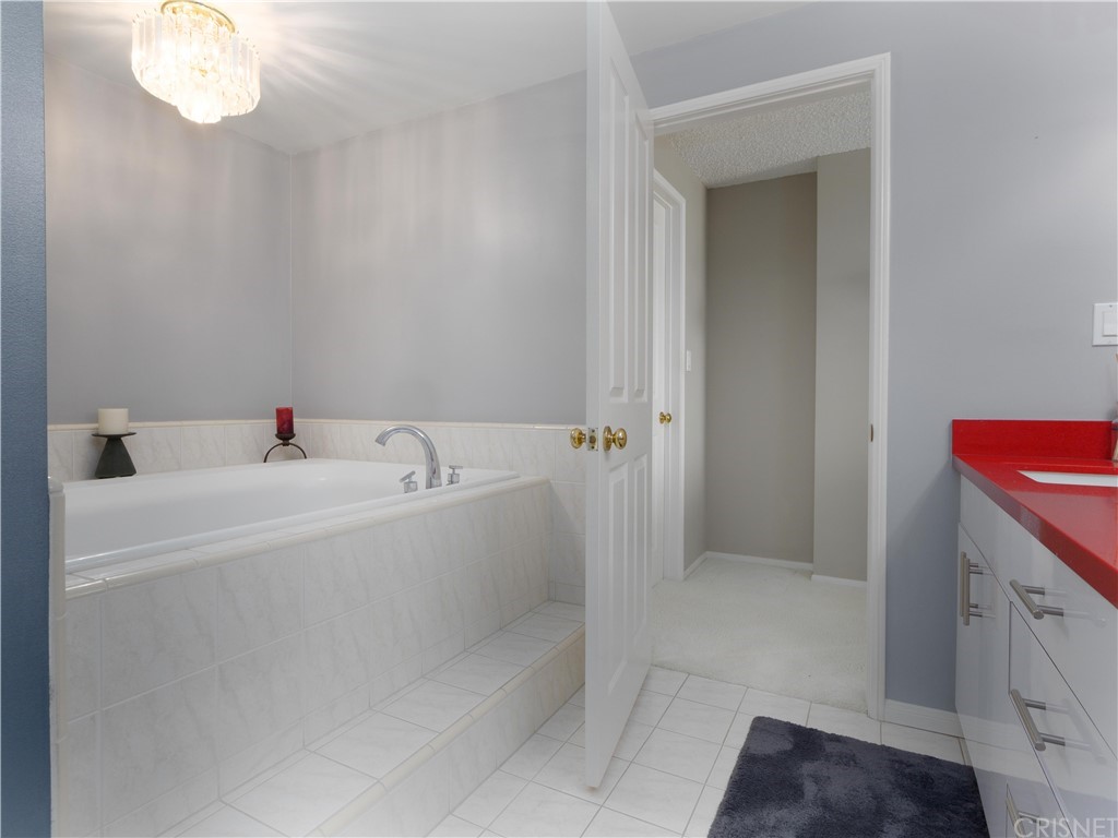 531 Esplanade, Unit 913 Redondo Beach, CA 90277 - Photo 32 of 42 a white bath tub sitting next to a white sink