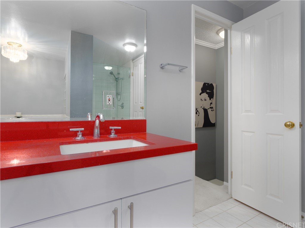 531 Esplanade, Unit 913 Redondo Beach, CA 90277 - Photo 33 of 42 a bathroom with a sink and a mirror