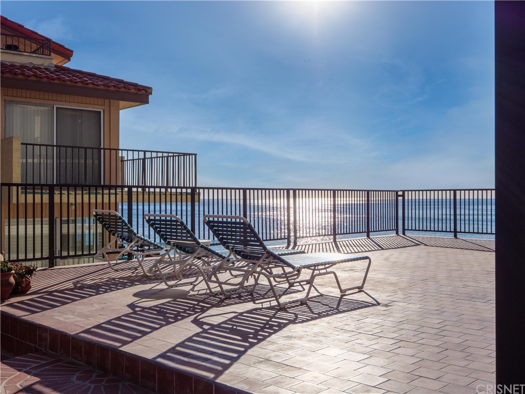 531 Esplanade, Unit 913 Redondo Beach, CA 90277 - Photo 35 of 42 a view of a roof deck with chair and wooden floor