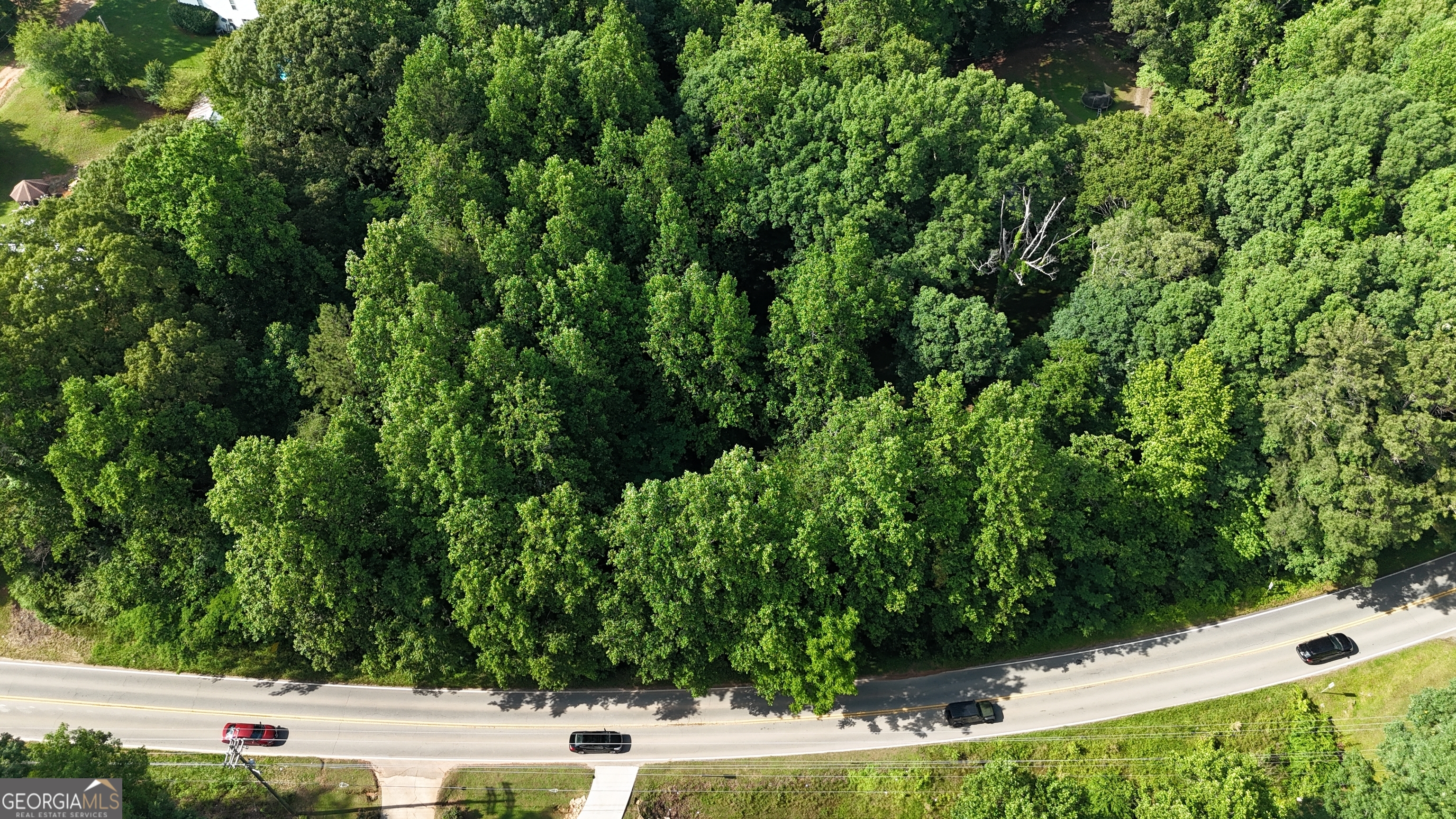 an aerial view of residential house with outdoor space