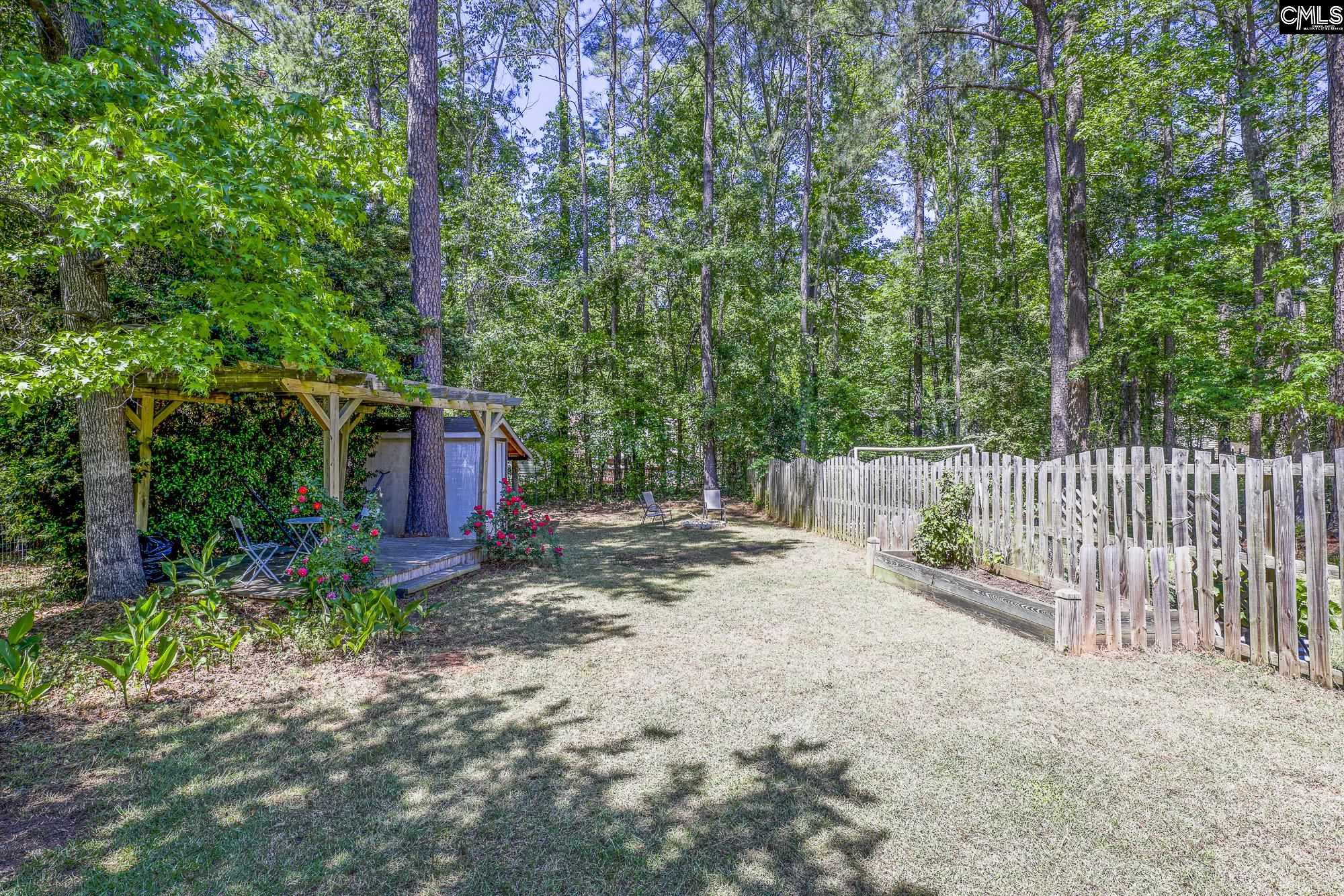 152 Thames Valley Court Irmo, SC 29063 - Photo 4 of 32 a view of a yard with trees