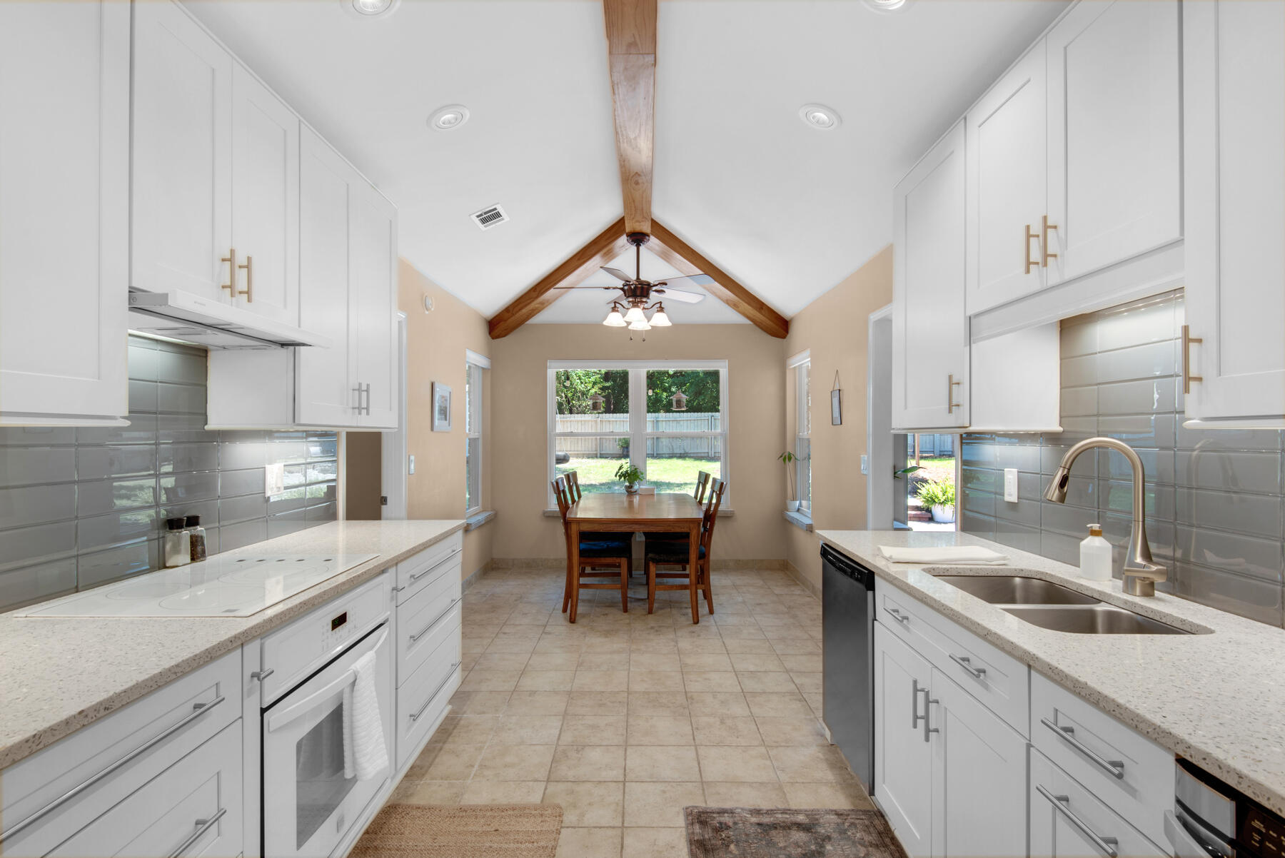 310 Antiqua Way Niceville, FL 32578 - Photo 16 of 39 a kitchen with a sink stove and cabinets