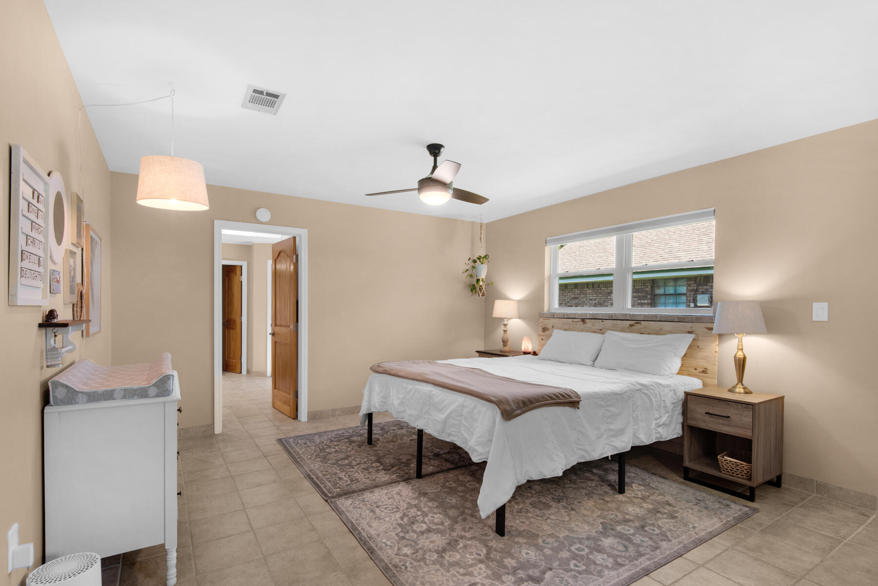 310 Antiqua Way Niceville, FL 32578 - Photo 17 of 39 a bedroom with a bed and a window