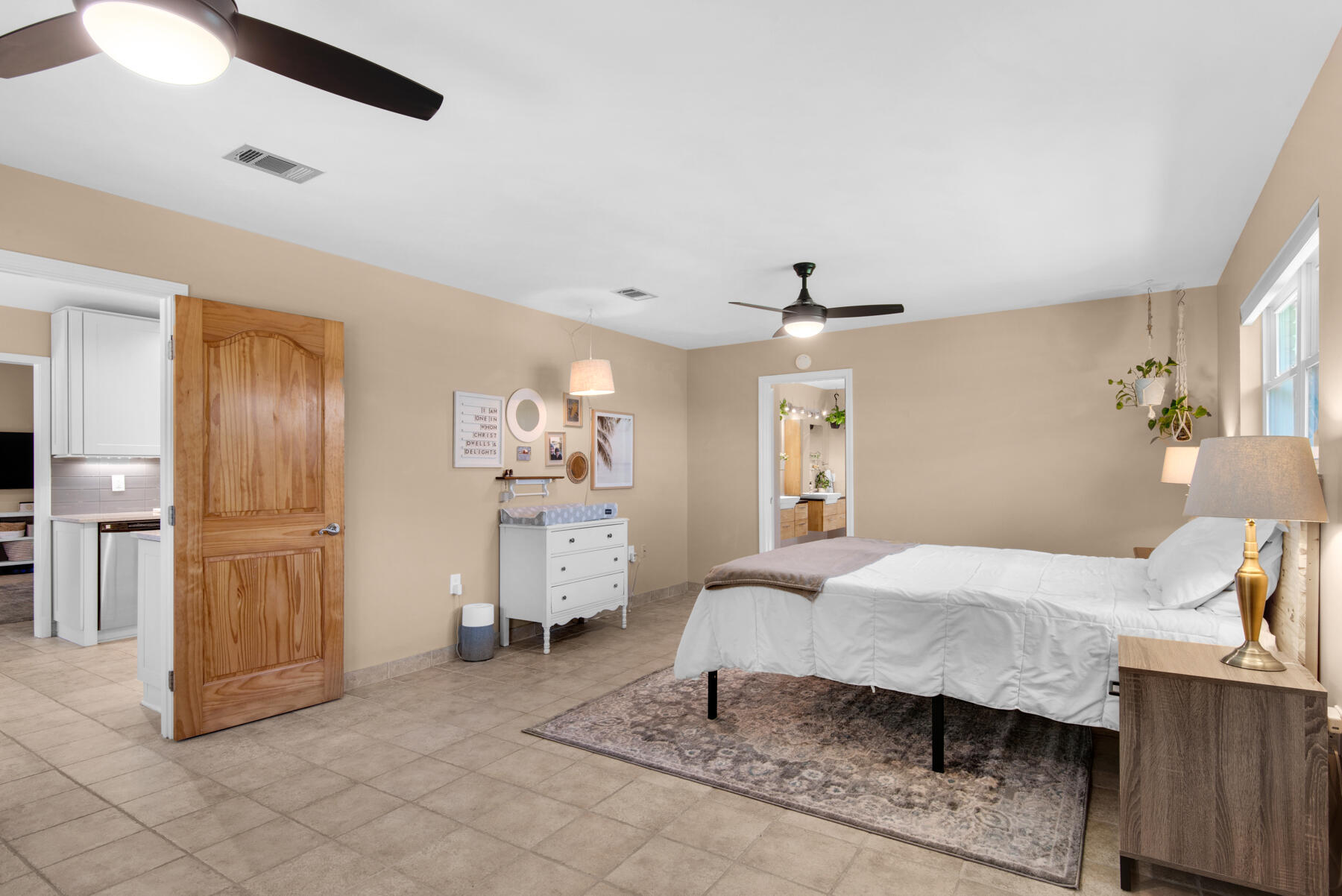 310 Antiqua Way Niceville, FL 32578 - Photo 18 of 39 a bedroom with a bed and wooden floor