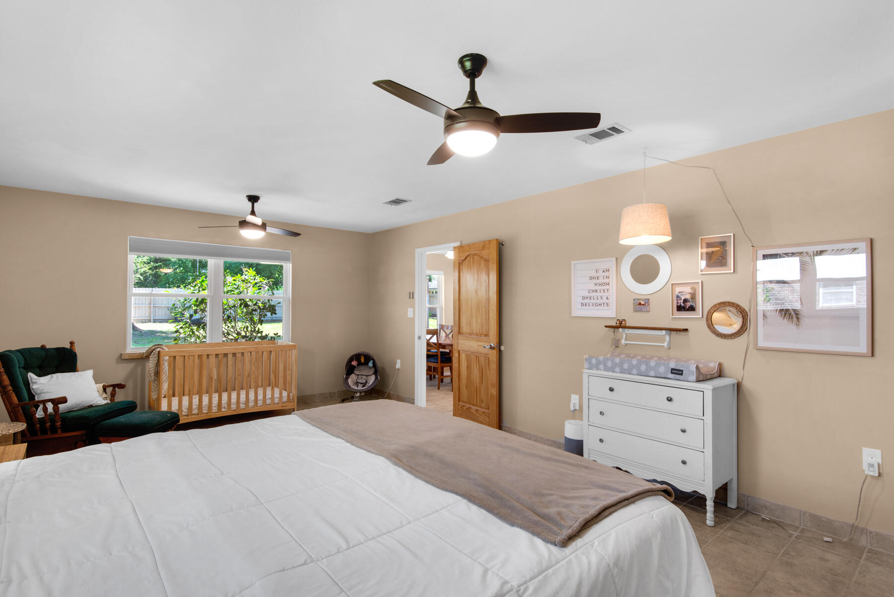 310 Antiqua Way Niceville, FL 32578 - Photo 19 of 39 a bedroom with a large bed and a window