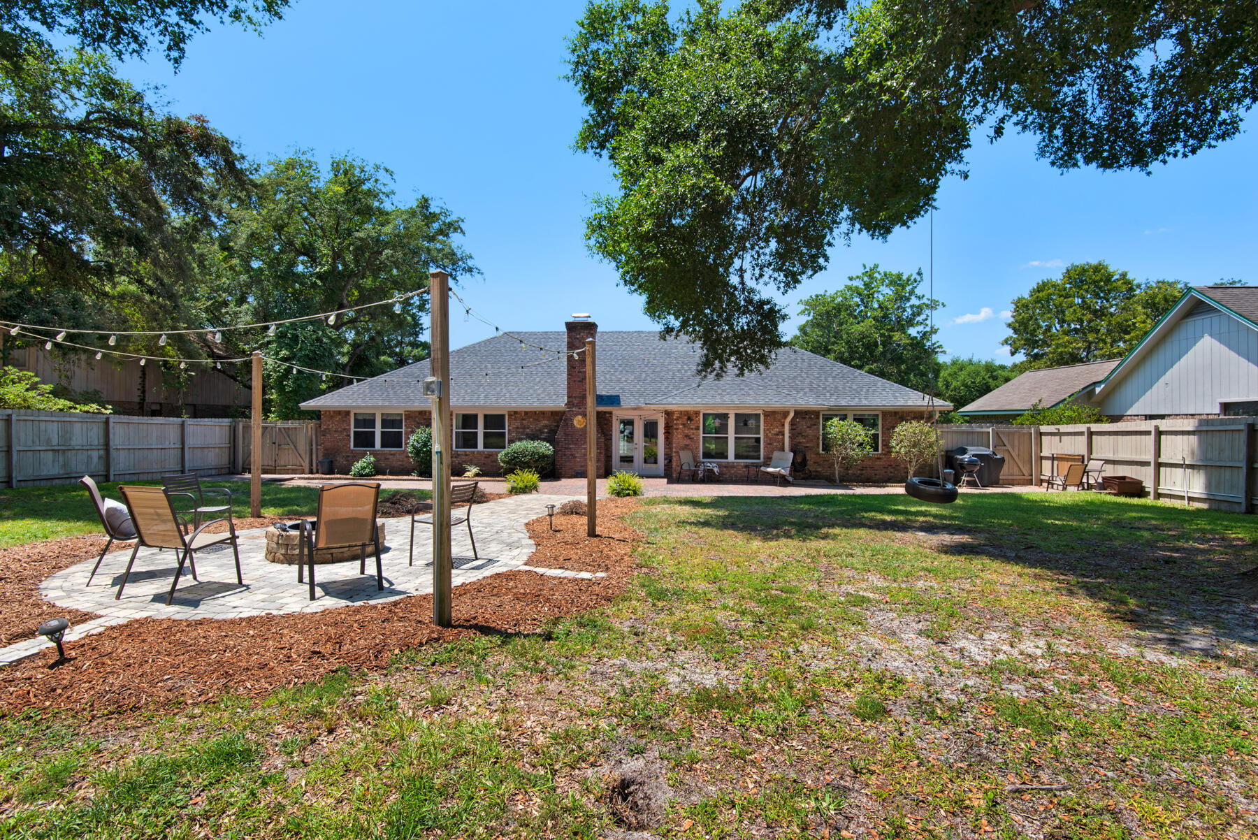 310 Antiqua Way Niceville, FL 32578 - Photo 2 of 39 a view of a house with a yard patio and fire pit