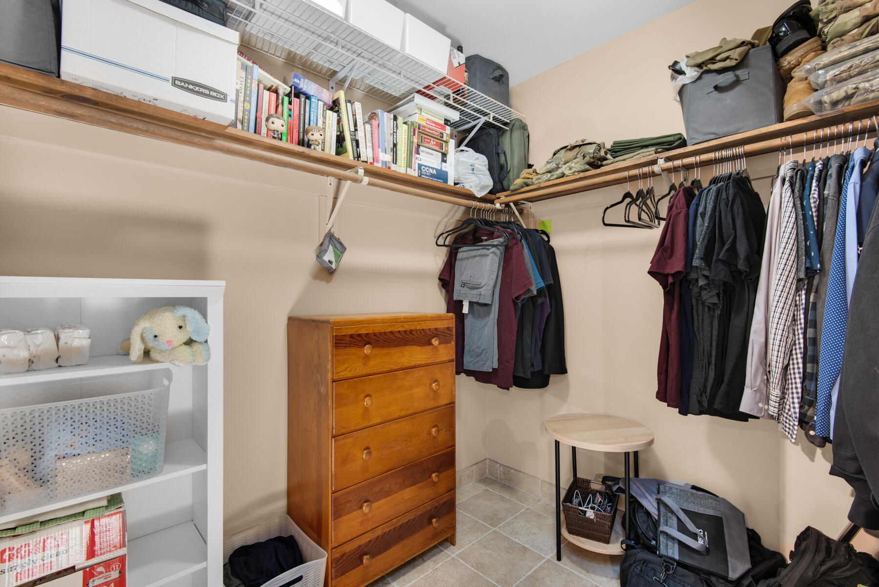 310 Antiqua Way Niceville, FL 32578 - Photo 24 of 39 a view of walk in closet with clothes and shoes