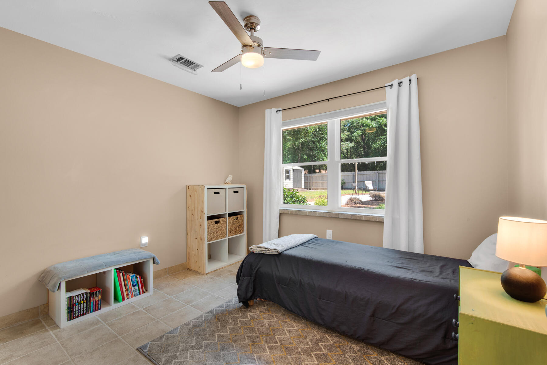 310 Antiqua Way Niceville, FL 32578 - Photo 27 of 39 a spacious bedroom with a bed window and a table in it