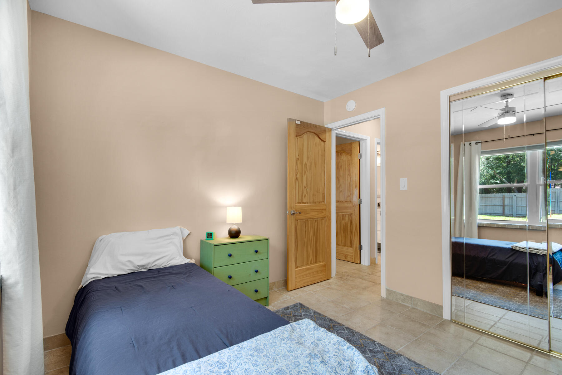 310 Antiqua Way Niceville, FL 32578 - Photo 28 of 39 a bedroom with a bed and a window