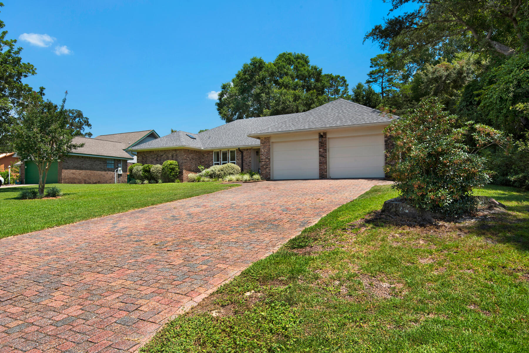 310 Antiqua Way Niceville, FL 32578 - Photo 3 of 39 a front view of a house with a yard and garage