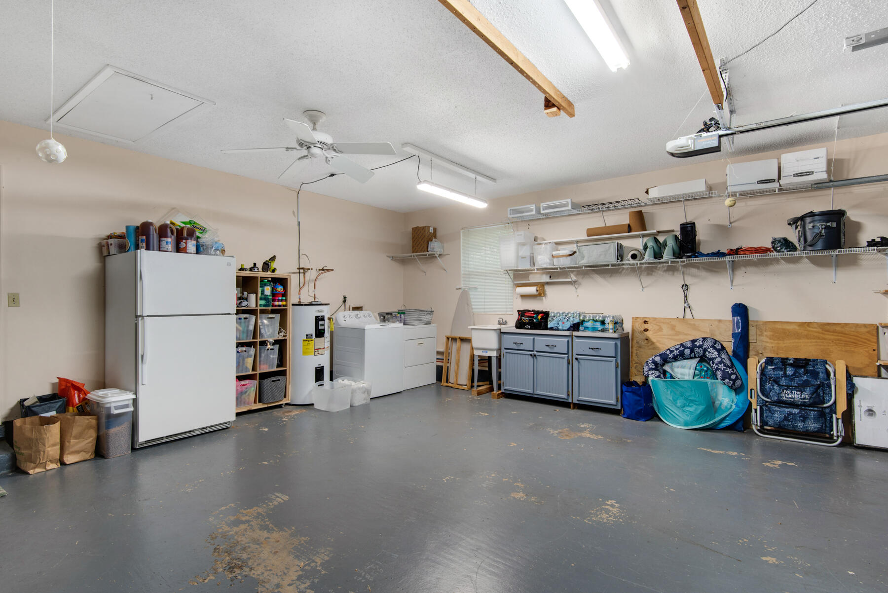 310 Antiqua Way Niceville, FL 32578 - Photo 32 of 39 a kitchen with refrigerator and cabinets