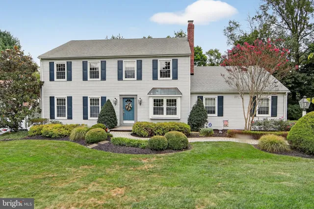 a front view of a house with a yard and porch
