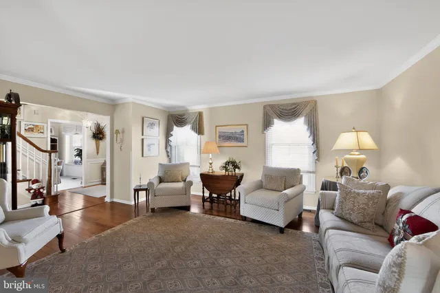 a living room with furniture and a lamp