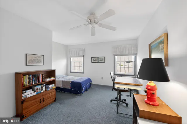 a bedroom with a bed and cabinets
