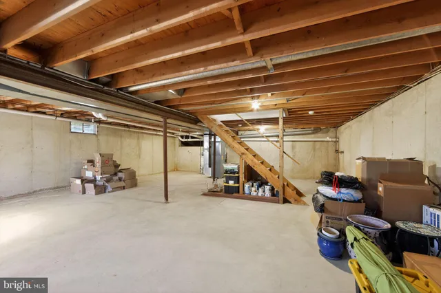 a view of empty room with wooden ceiling