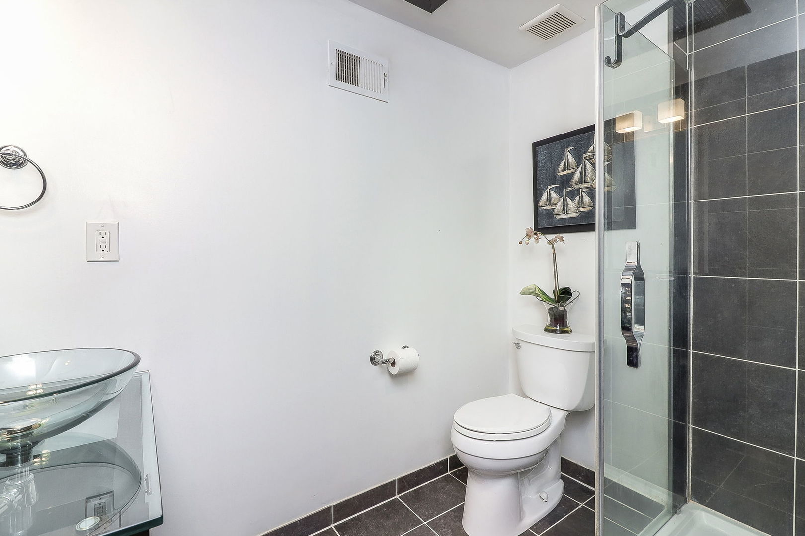 Undisclosed Address Countryside, IL 60525 - Photo 4 of 16 a white toilet sitting next to a bathroom sink