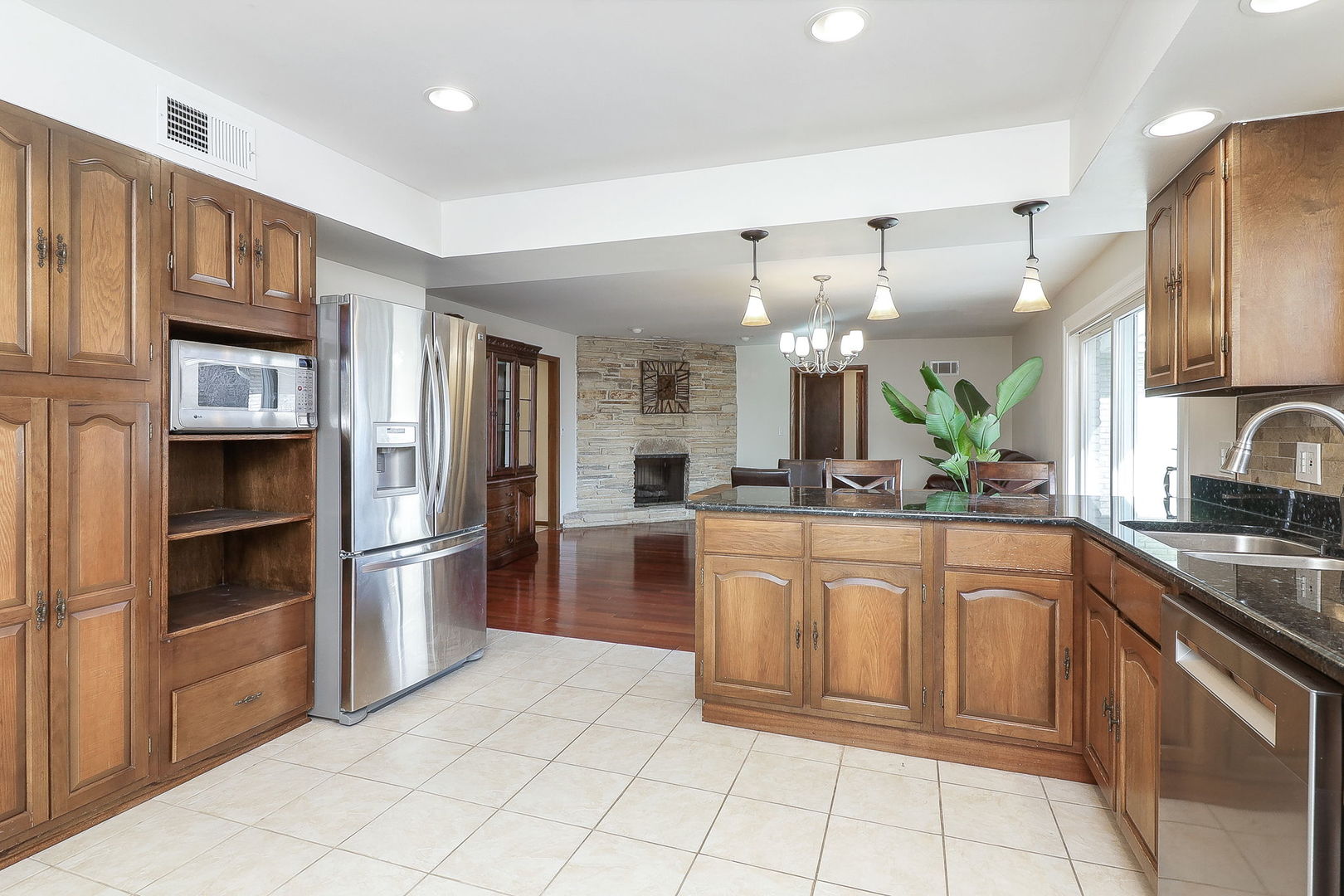Undisclosed Address Countryside, IL 60525 - Photo 6 of 16 a large kitchen with cabinets and stainless steel appliances