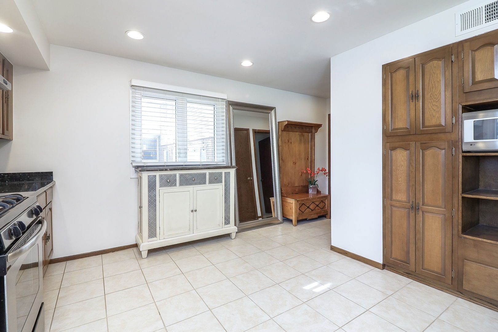 Undisclosed Address Countryside, IL 60525 - Photo 7 of 16 a view of a kitchen with a sink and a refrigerator