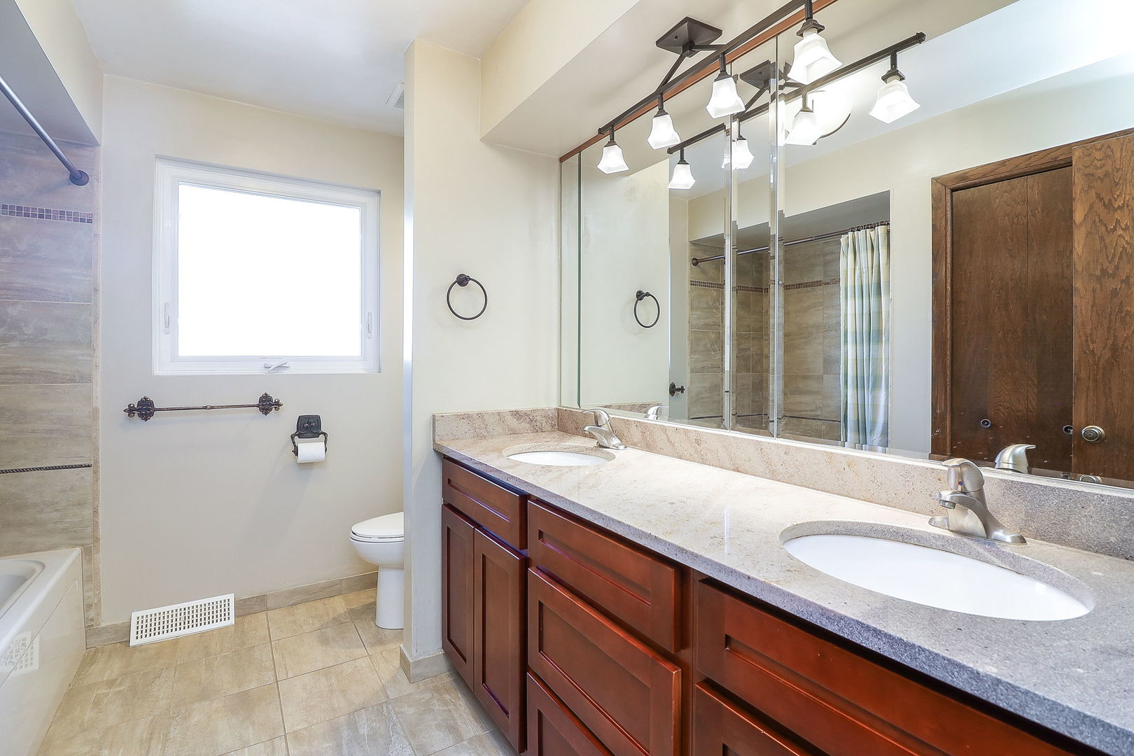 Undisclosed Address Countryside, IL 60525 - Photo 9 of 16 a bathroom with a granite countertop sink mirror and a toilet