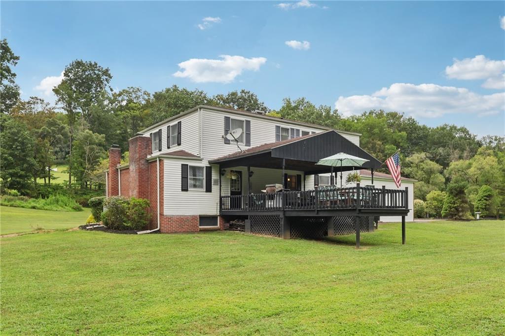 748 Four Mile Run Road Ligonier, PA 15658 - Photo 11 of 49 a front view of a house with a garden