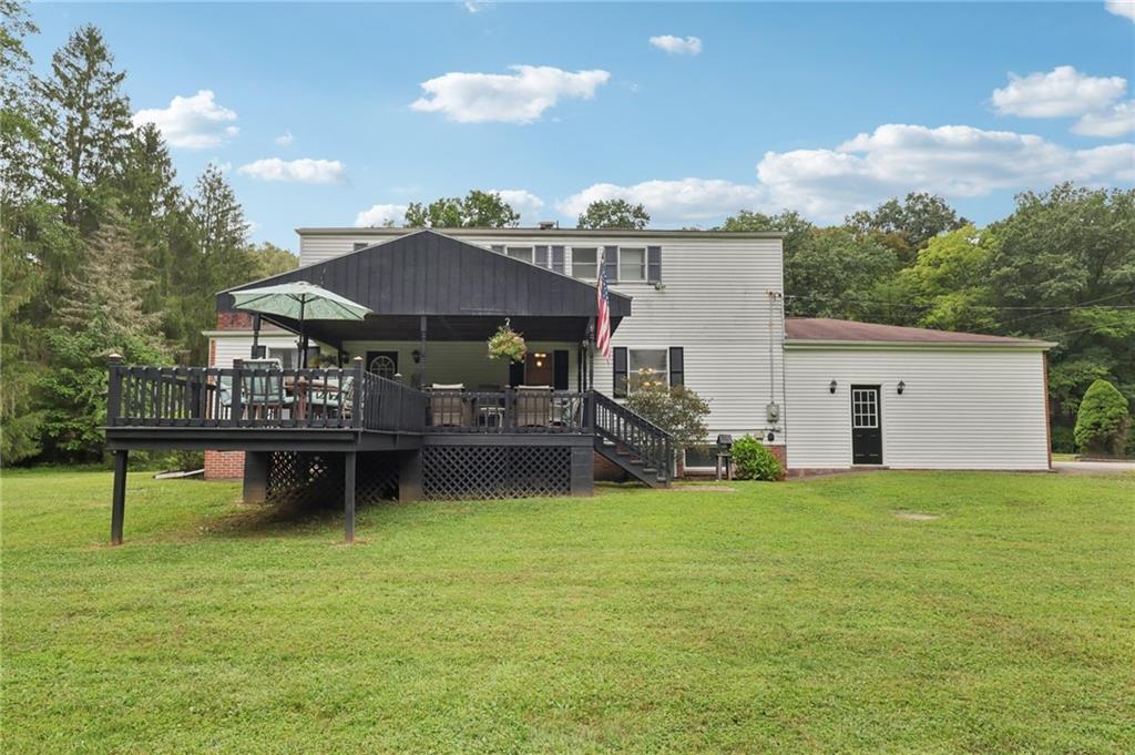 748 Four Mile Run Road Ligonier, PA 15658 - Photo 12 of 49 a view of a house with pool and a yard