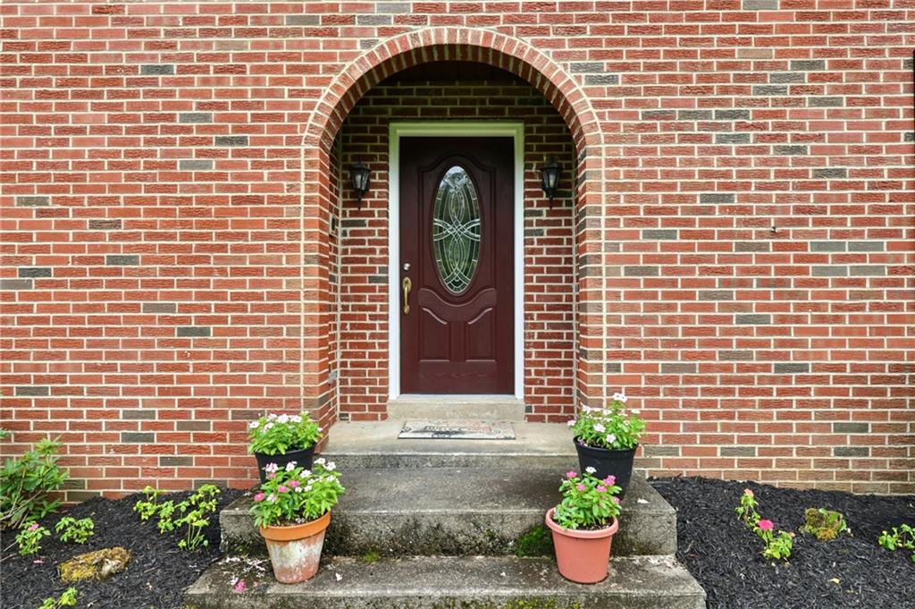 748 Four Mile Run Road Ligonier, PA 15658 - Photo 15 of 49 a front view of a house with potted plants