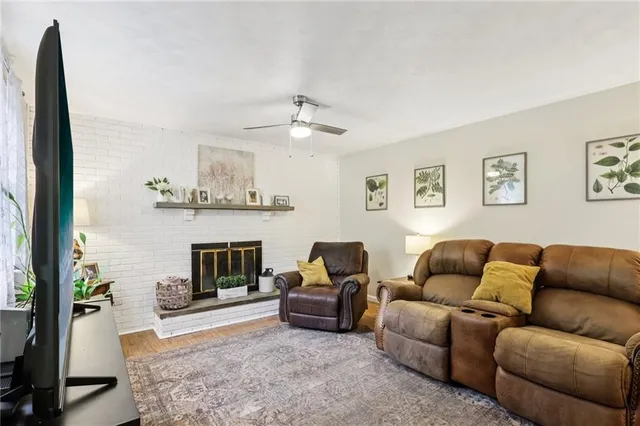 a living room with furniture and a fireplace