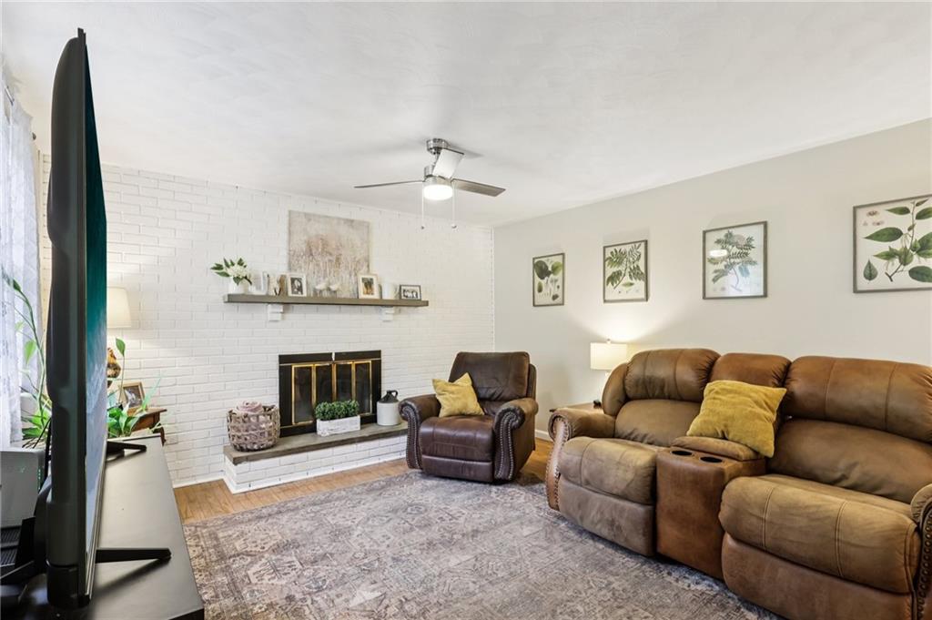 748 Four Mile Run Road Ligonier, PA 15658 - Photo 29 of 49 a living room with furniture and a fireplace