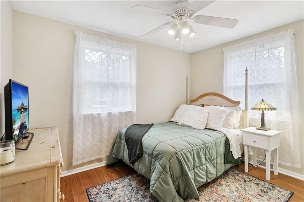 748 Four Mile Run Road Ligonier, PA 15658 - Photo 32 of 49 a bedroom with a bed and a chandelier