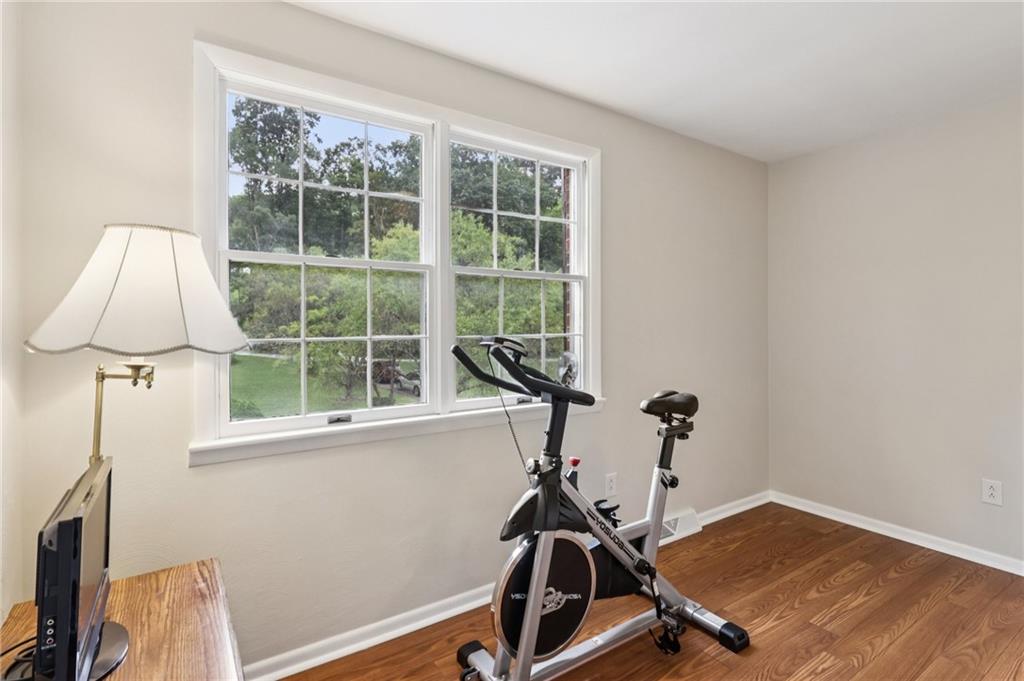 748 Four Mile Run Road Ligonier, PA 15658 - Photo 47 of 49 a room with gym equipment and a large window