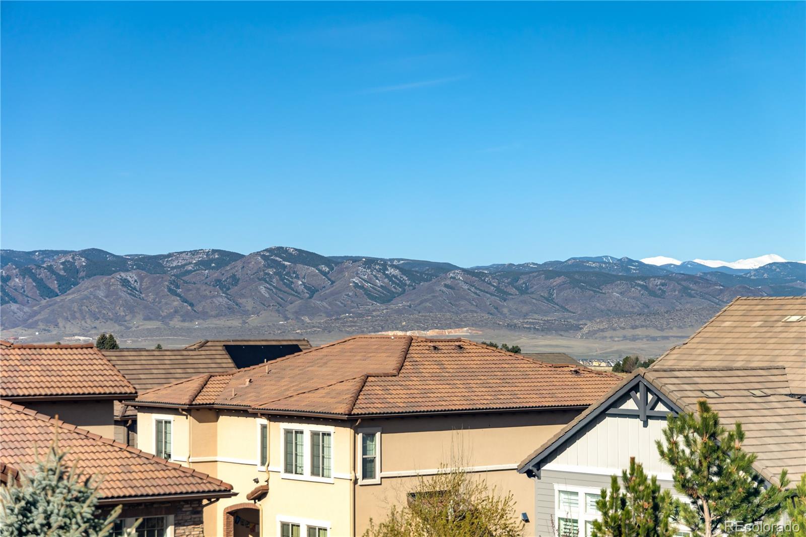 10681 Sundial Rim Road Highlands Ranch, CO 80126 - Photo 19 of 45 a view of a house with mountain