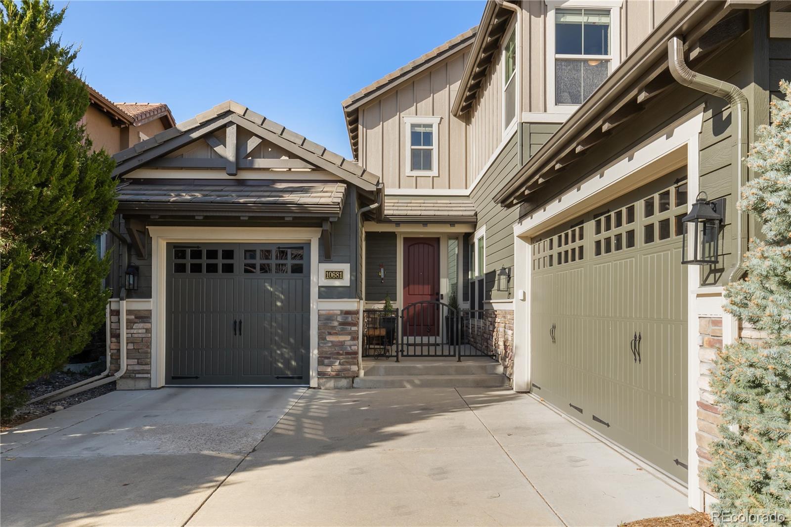 10681 Sundial Rim Road Highlands Ranch, CO 80126 - Photo 2 of 45 front view of a house with a small yard