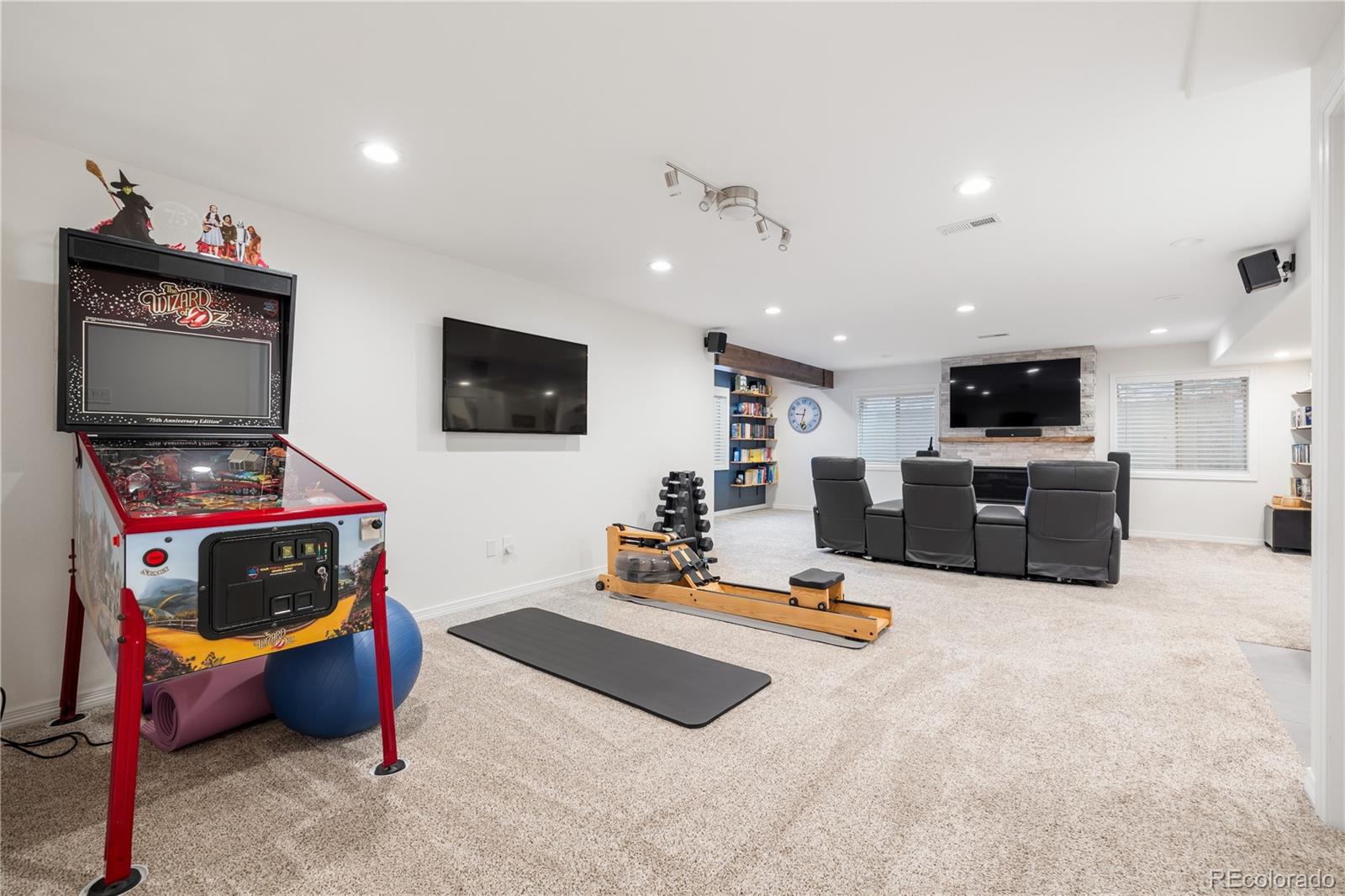 10681 Sundial Rim Road Highlands Ranch, CO 80126 - Photo 32 of 45 a living room with furniture and a flat screen tv
