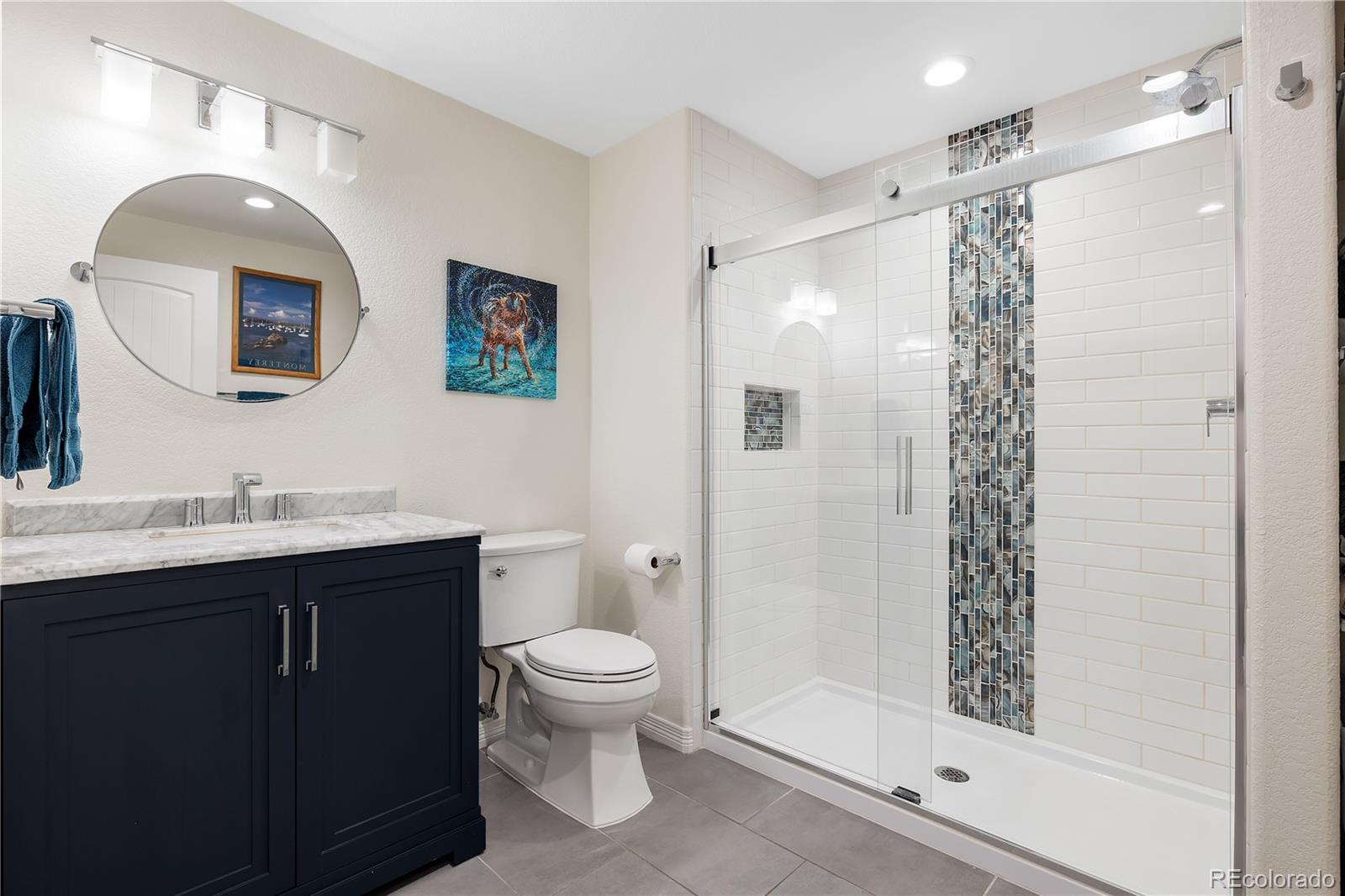 10681 Sundial Rim Road Highlands Ranch, CO 80126 - Photo 36 of 45 a bathroom with a toilet sink and shower