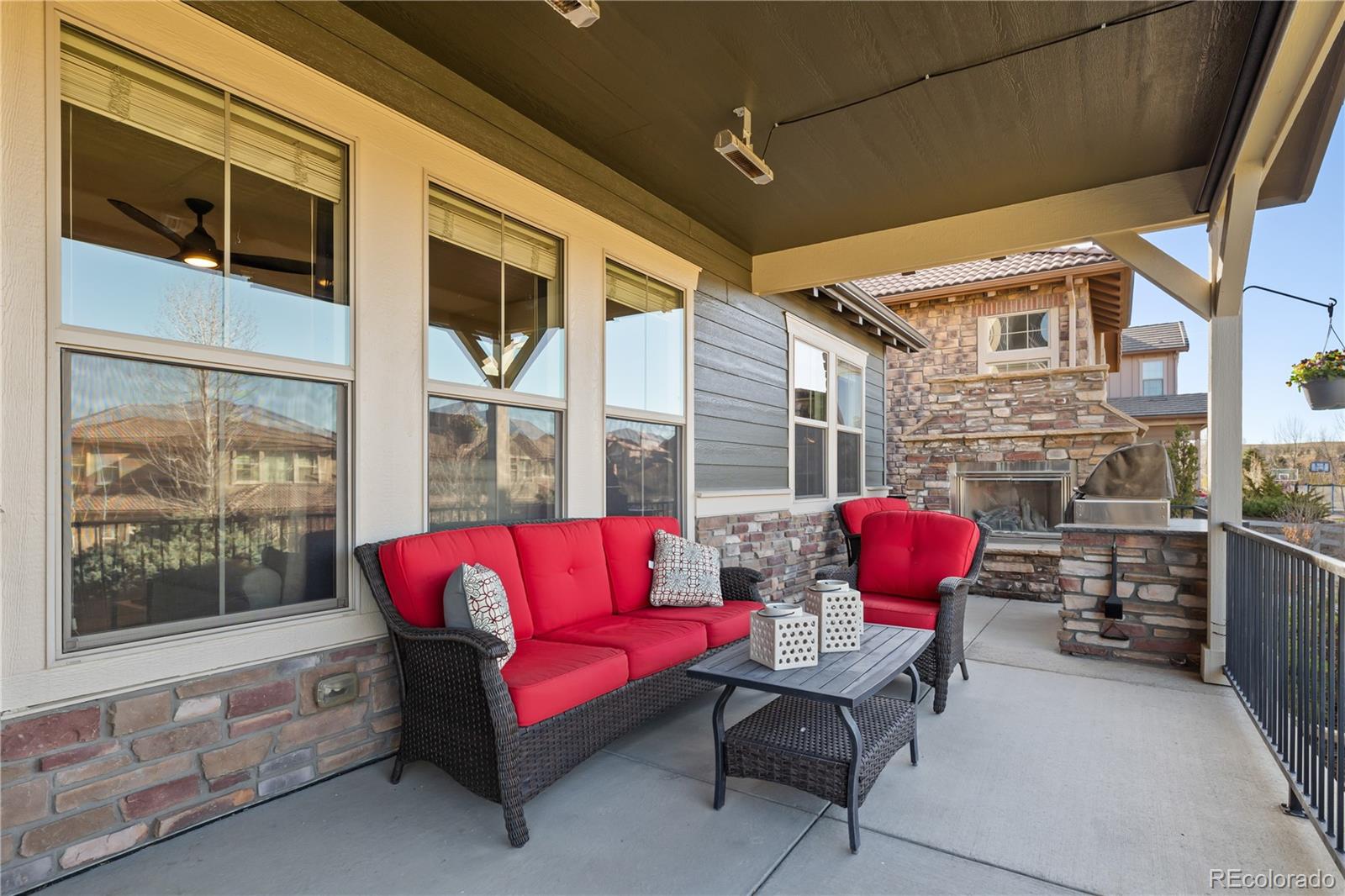 10681 Sundial Rim Road Highlands Ranch, CO 80126 - Photo 37 of 45 a outdoor space with patio the couches and a potted plant on a table