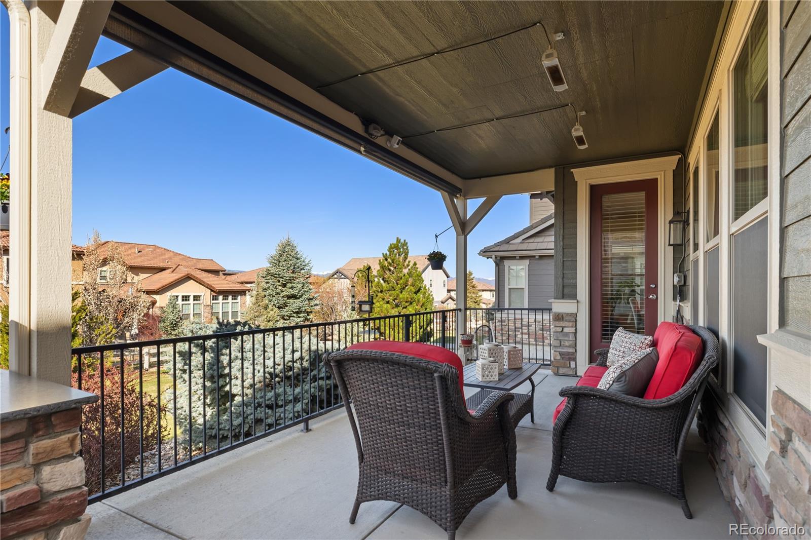10681 Sundial Rim Road Highlands Ranch, CO 80126 - Photo 38 of 45 a view of a chairs and table in patio of the house