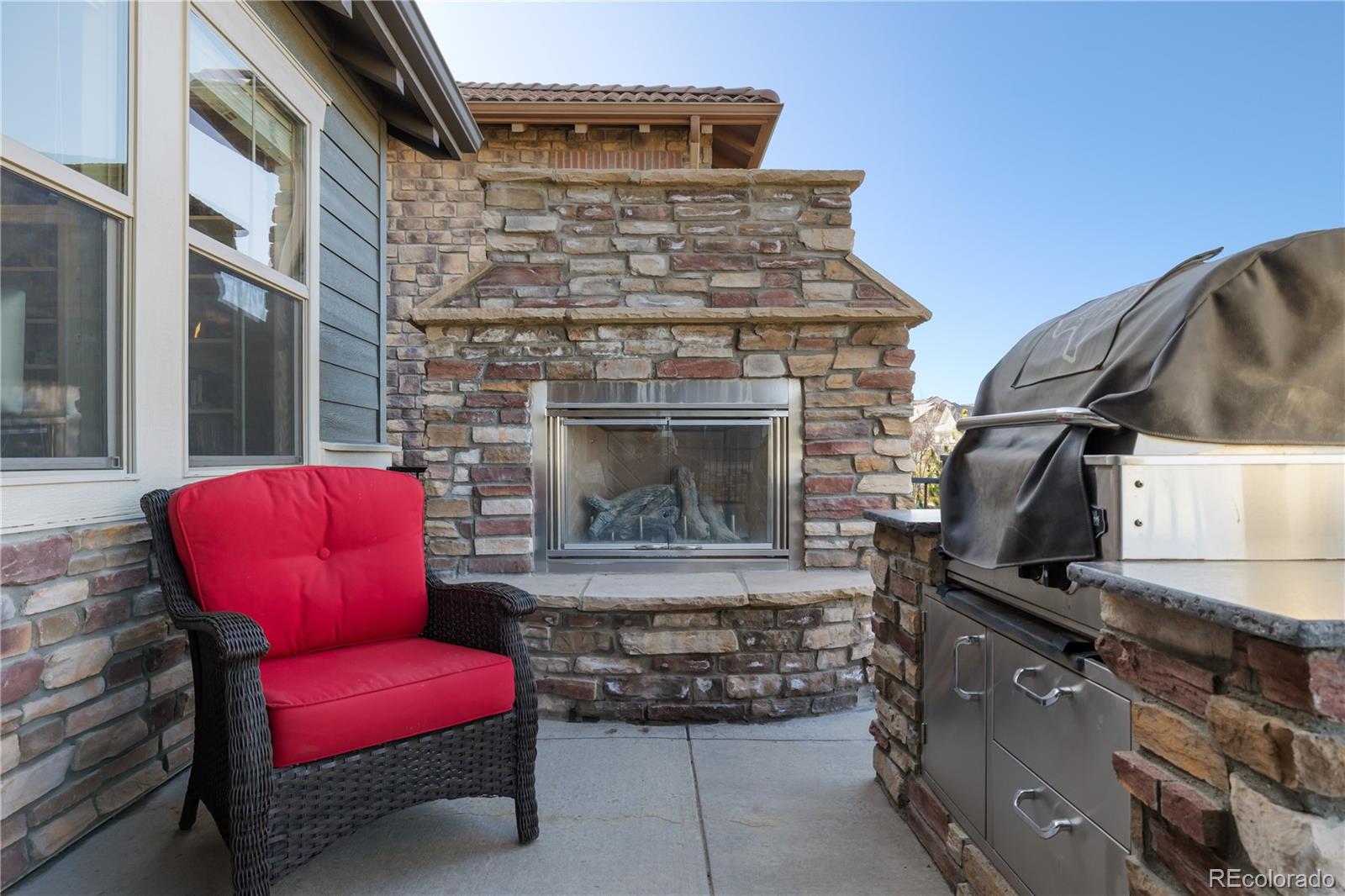 10681 Sundial Rim Road Highlands Ranch, CO 80126 - Photo 39 of 45 a living room with furniture and a fireplace