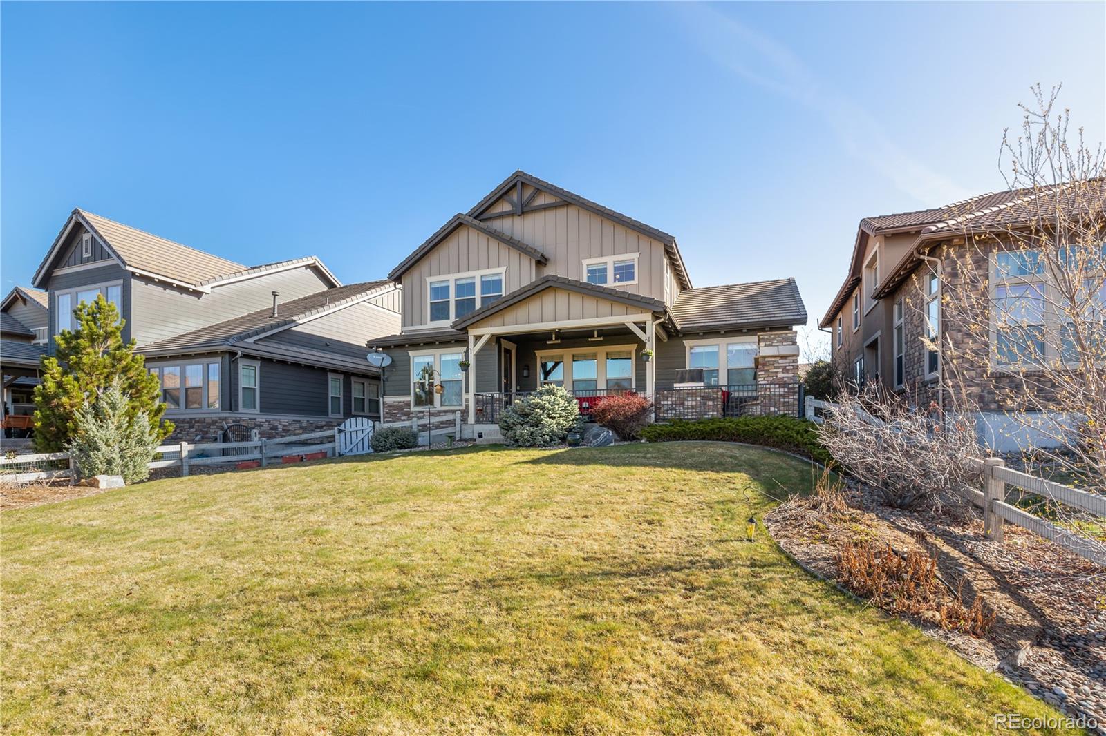 10681 Sundial Rim Road Highlands Ranch, CO 80126 - Photo 40 of 45 a front view of a house with swimming pool