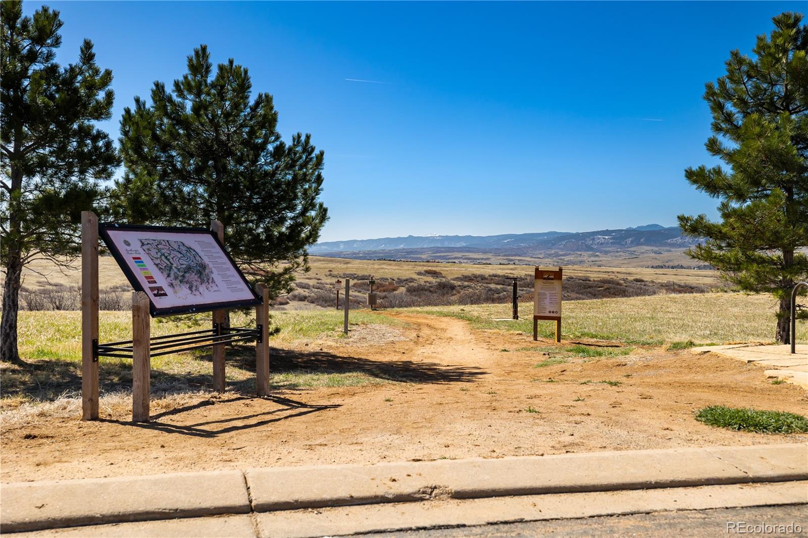 10681 Sundial Rim Road Highlands Ranch, CO 80126 - Photo 44 of 45 a view of a swimming pool with an ocean view