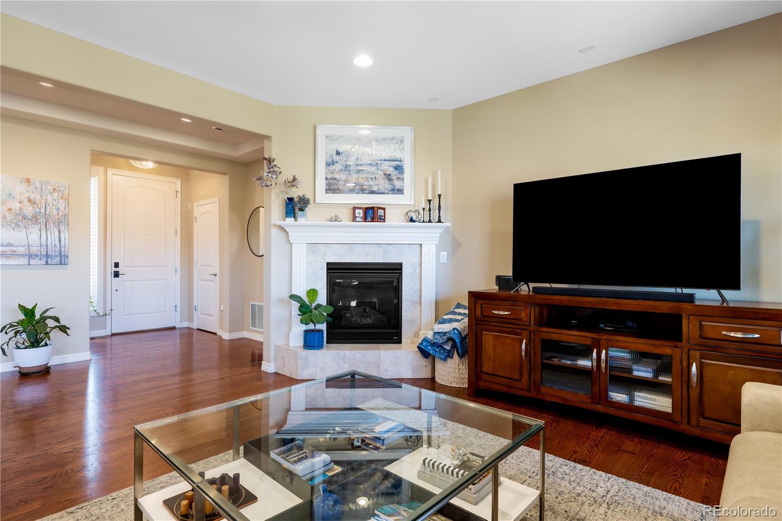 10681 Sundial Rim Road Highlands Ranch, CO 80126 - Photo 5 of 45 a living room with furniture and a flat screen tv