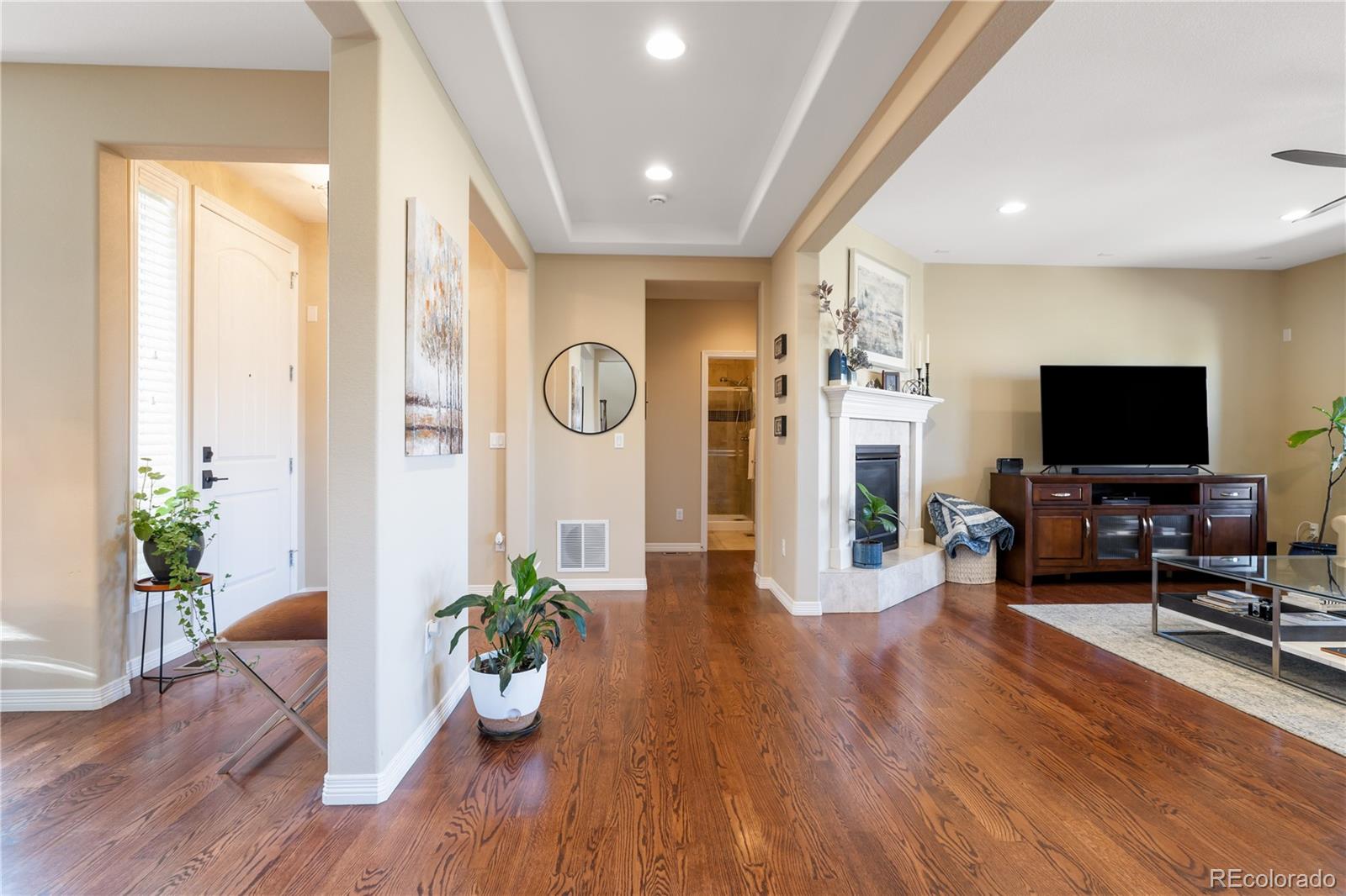 10681 Sundial Rim Road Highlands Ranch, CO 80126 - Photo 10 of 45 a living room with furniture and a flat screen tv