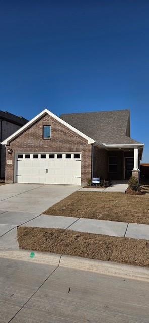 1733 Arches Road Anna, TX 75409 - Photo 2 of 17 a front view of a house with a yard